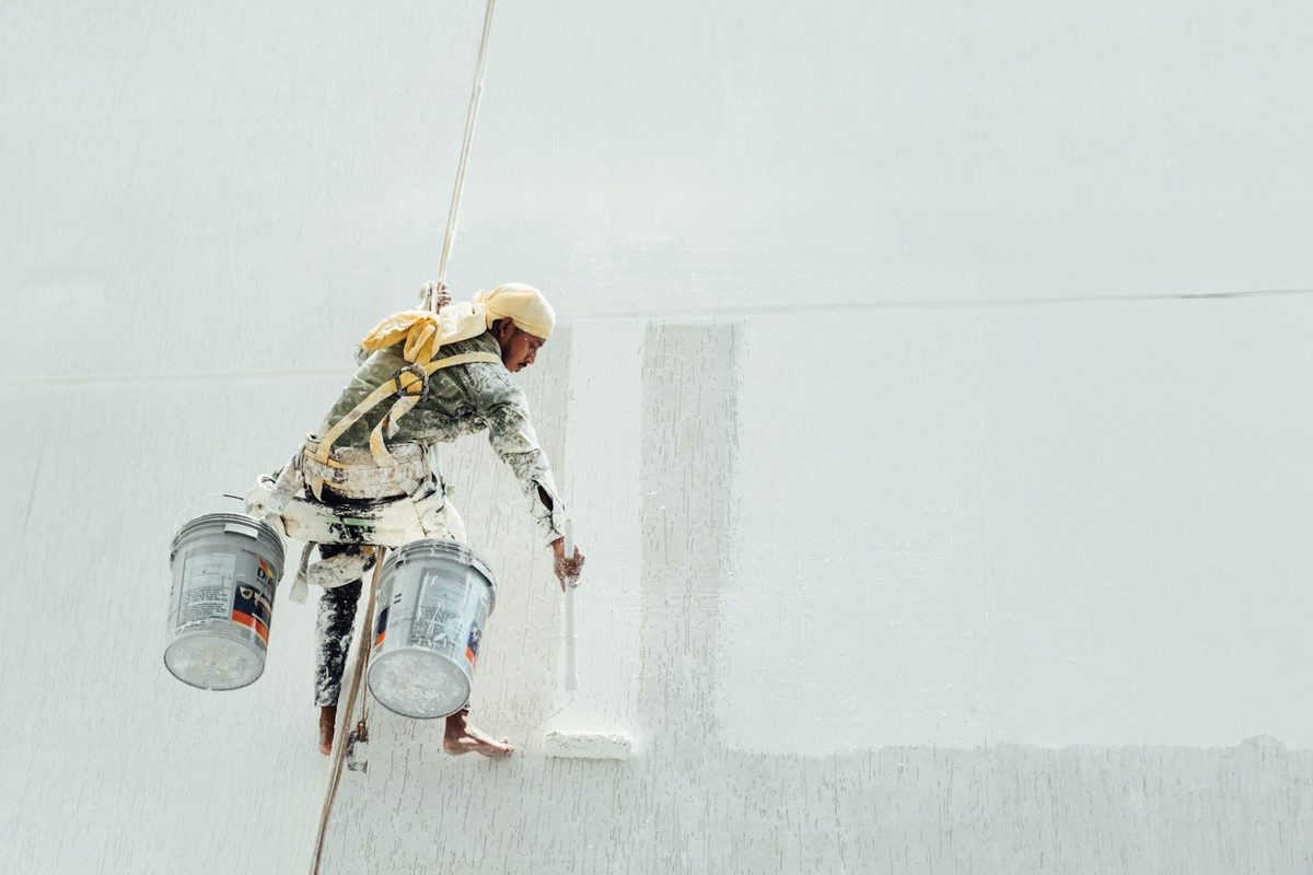 Painter at work on an interior wall